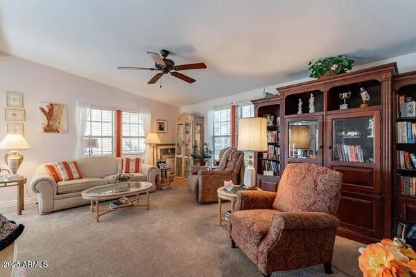 a living room with furniture and a large window
