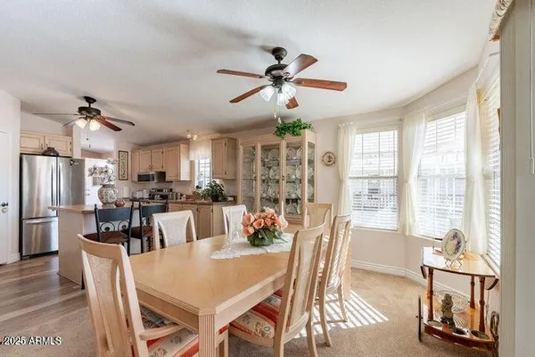 a view of a chairs and table in the patio