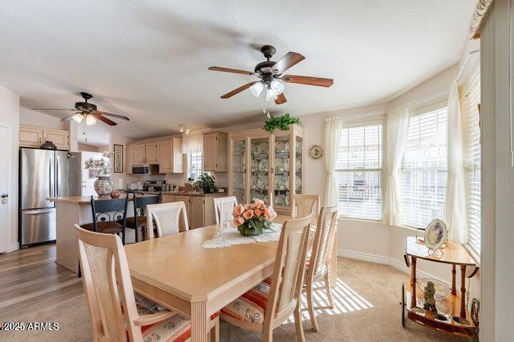 201 South Greenfield Road, Unit 176 Mesa, AZ 85206 - Photo 27 of 61 a view of a dining room with furniture window and outside view
