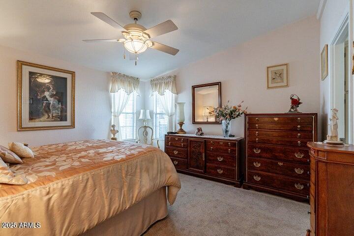 201 South Greenfield Road, Unit 176 Mesa, AZ 85206 - Photo 35 of 61 a bedroom with a bed and a dresser