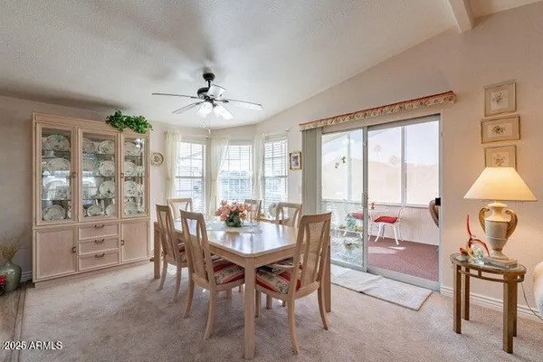 a bathroom with a granite countertop sink a shower and a mirror