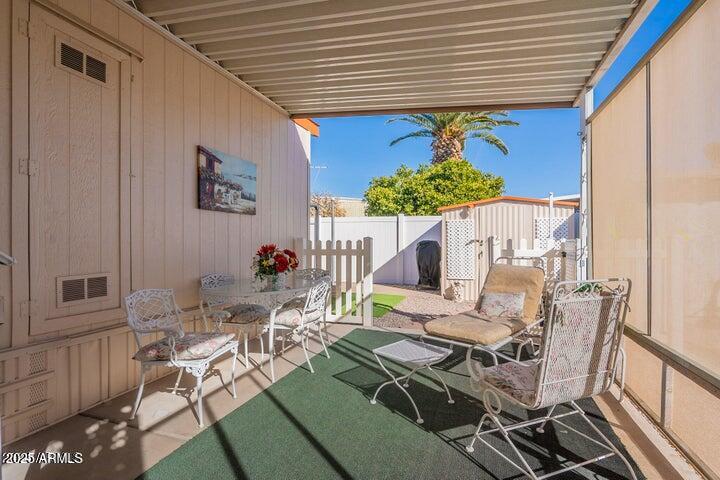 201 South Greenfield Road, Unit 176 Mesa, AZ 85206 - Photo 41 of 61 a view of a patio with table and chairs and potted plants