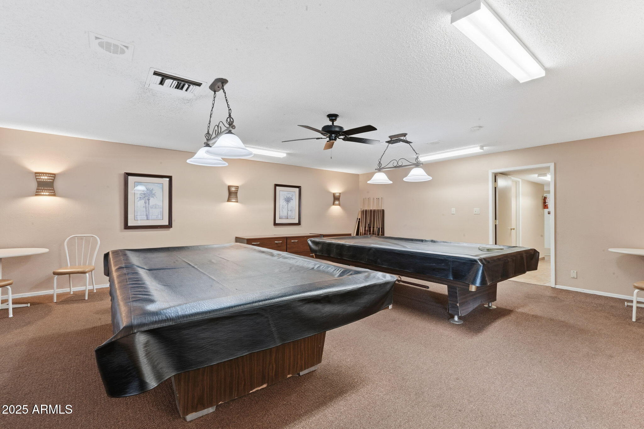 201 South Greenfield Road, Unit 176 Mesa, AZ 85206 - Photo 51 of 61 a living room with a table chairs and a chandelier