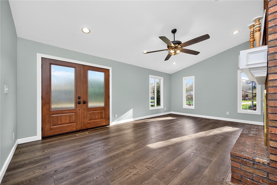4747 Fawnwood Road Dayton, OH 45429 - Photo 17 of 58 This airy living space features warm wood flooring and a classic brick fireplace.
