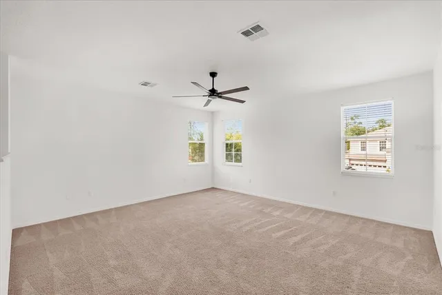 a view of a big room with carpet