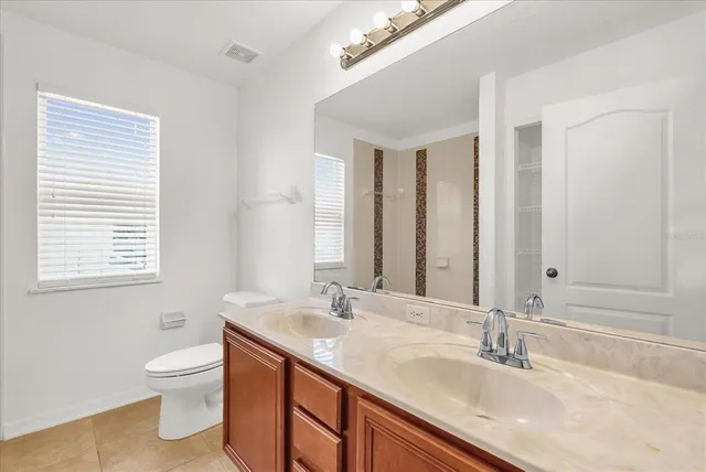 a view of a livingroom with a ceiling fan and window