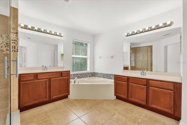 a bathroom with a shower and a sink