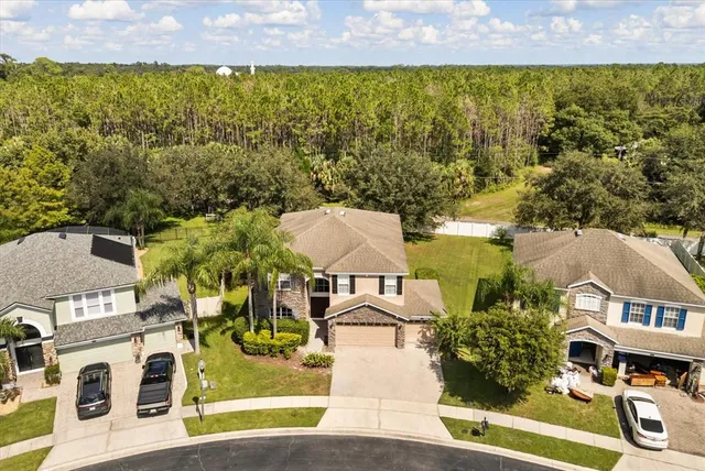 an aerial view of residential houses with outdoor space