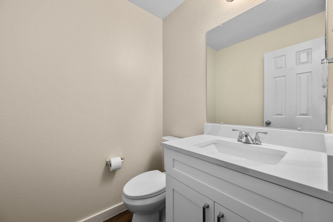 11116 Jim Thorpe Lane Austin, TX 78748 - Photo 14 of 31 a bathroom with a sink toilet and a mirror