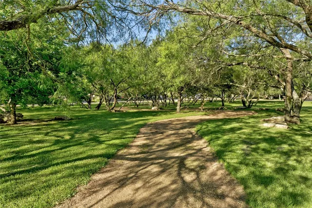 a view of a golf course with a trees
