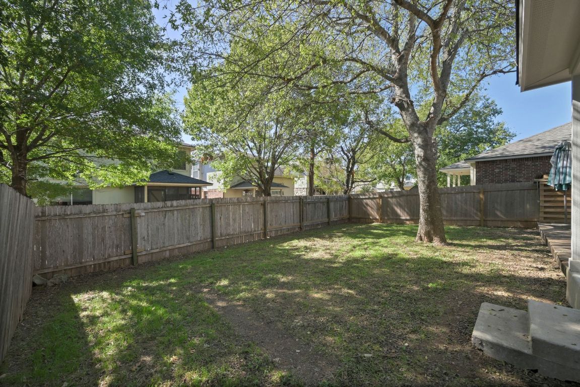11116 Jim Thorpe Lane Austin, TX 78748 - Photo 23 of 31 a backyard of a house with lots of green space