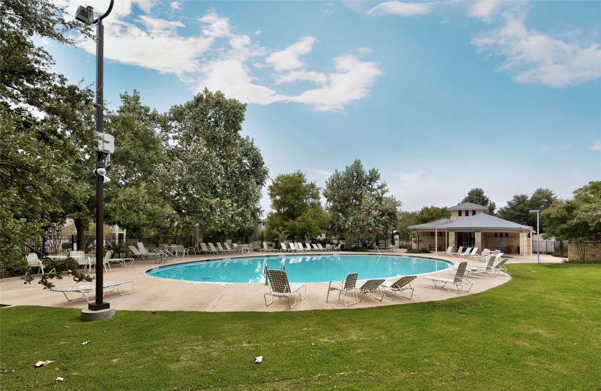 11116 Jim Thorpe Lane Austin, TX 78748 - Photo 26 of 31 a view of a swimming pool with a yard