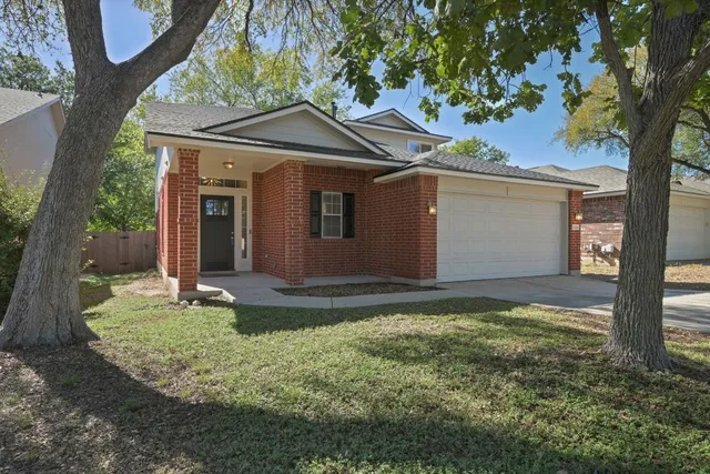 a backyard of a house with yard and garage