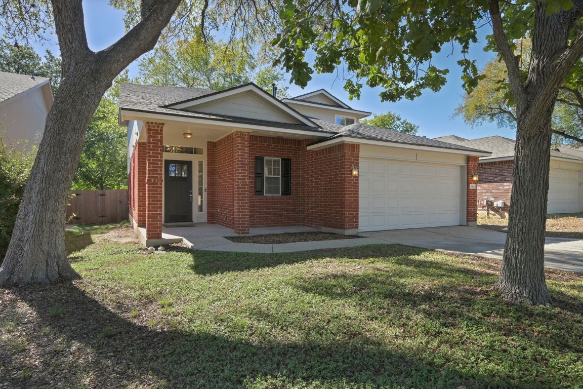 11116 Jim Thorpe Lane Austin, TX 78748 - Photo 30 of 31 a backyard of a house with yard and garage