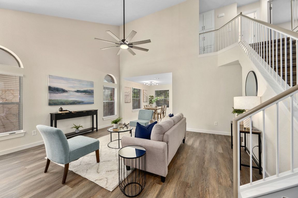 11116 Jim Thorpe Lane Austin, TX 78748 - Photo 6 of 31 a dining room with furniture a floor to ceiling window and wooden floor