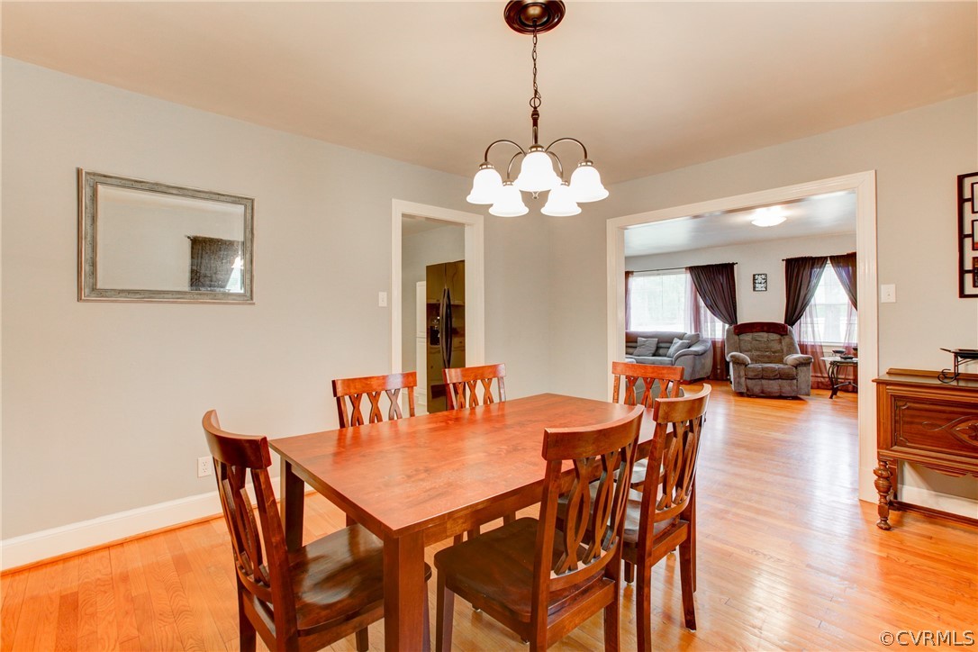 18506 Beaver Dam Road Beaverdam, VA 23015 - Photo 14 of 44 a view of a dining room with furniture wooden floor and chandelier
