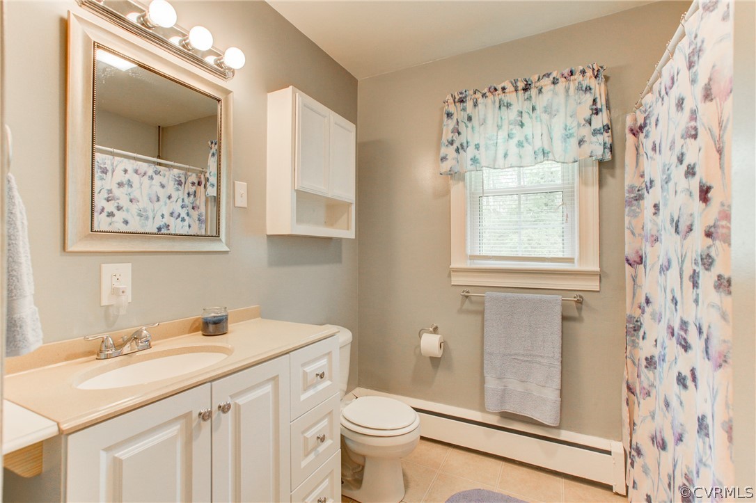 18506 Beaver Dam Road Beaverdam, VA 23015 - Photo 19 of 44 a bathroom with a sink a toilet and a mirror