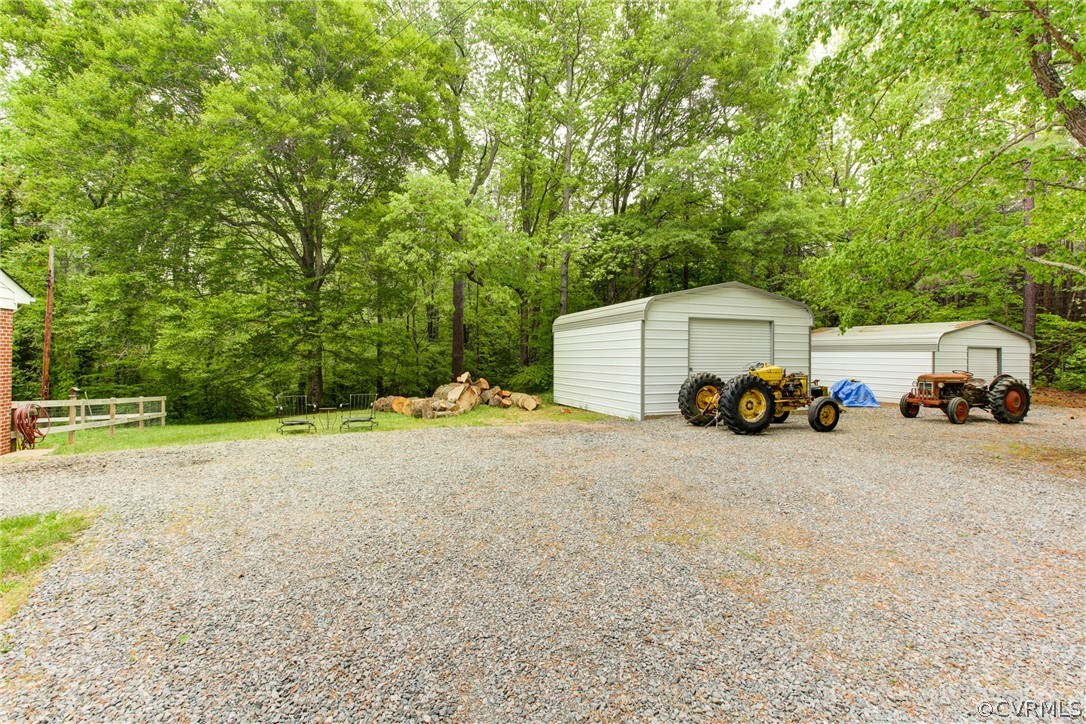 18506 Beaver Dam Road Beaverdam, VA 23015 - Photo 33 of 44 a car parked in front of a house with wooden fence