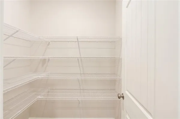 a view of a room with racks on the wall