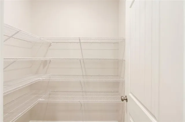 a view of a room with racks on the wall