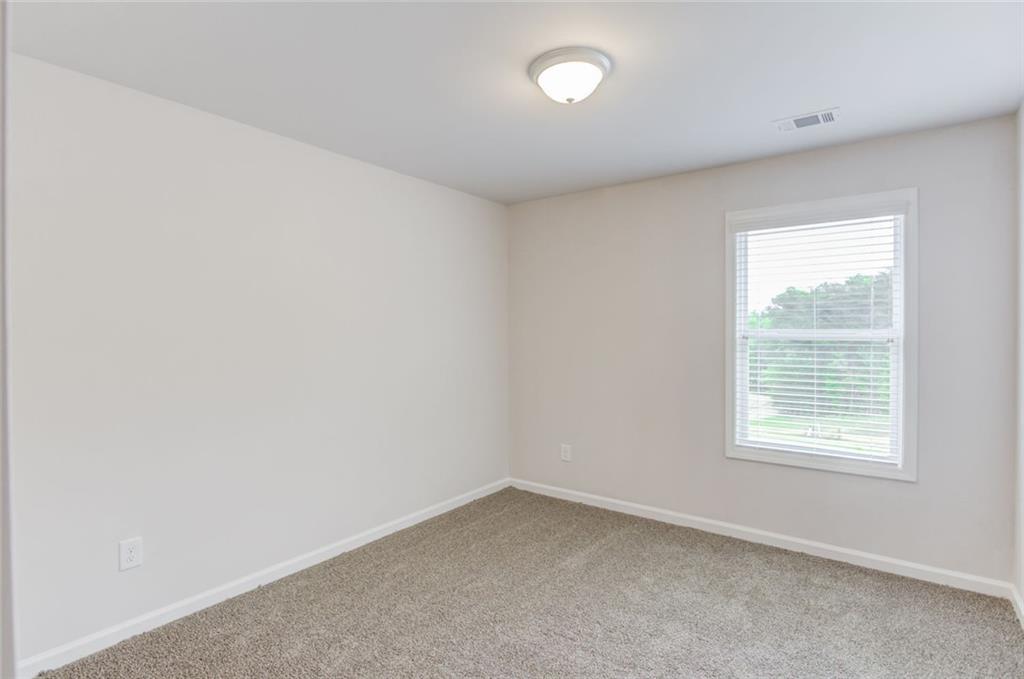 6334 Pine Ridge Point Lula, GA 30554 - Photo 26 of 32 an empty room with a window