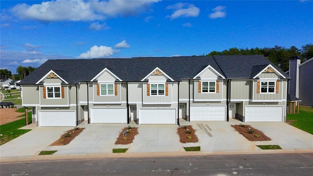 6334 Pine Ridge Point Lula, GA 30554 - Photo 3 of 32 a view of house and outdoor space with swimming pool
