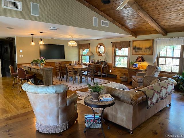 617 Bean River Road Pine Plains, NY 12546 - Photo 11 of 40 a living room with furniture potted plant kitchen view and a large window