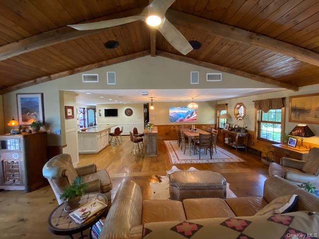 617 Bean River Road Pine Plains, NY 12546 - Photo 13 of 40 a living room with lots of furniture and a large window