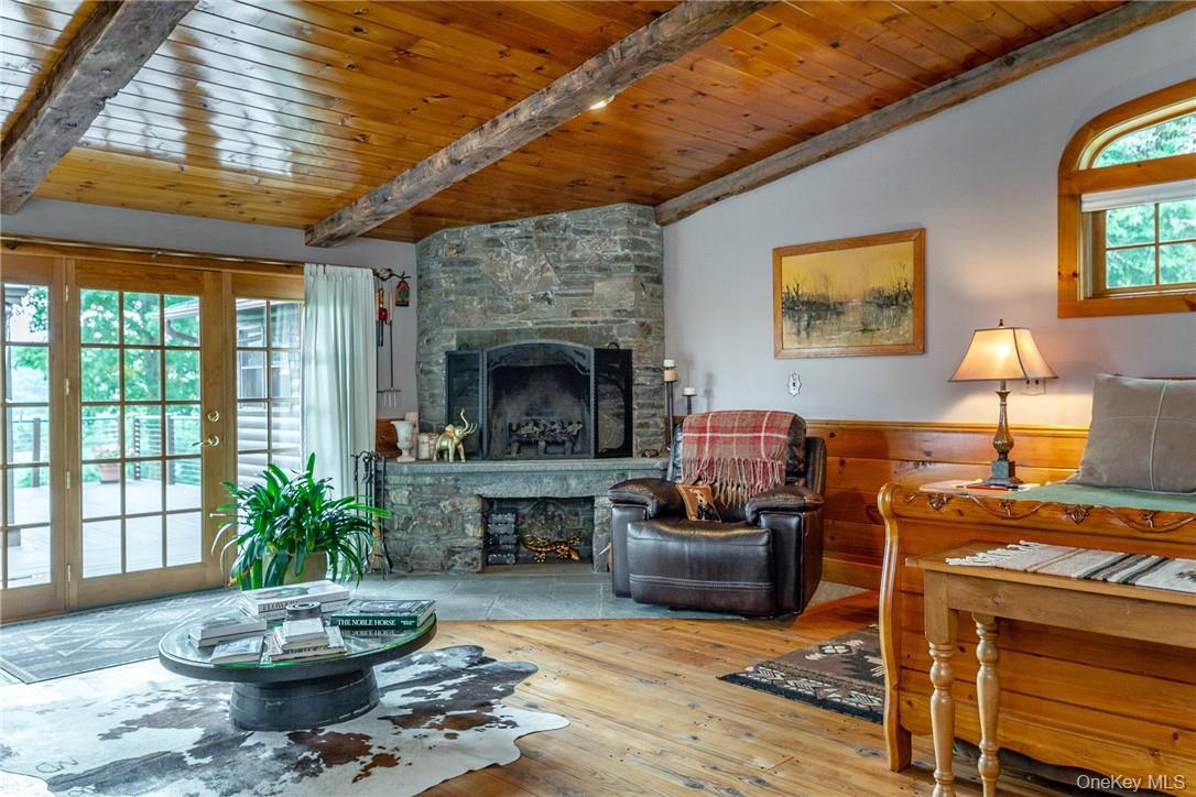 617 Bean River Road Pine Plains, NY 12546 - Photo 15 of 40 a living room with furniture and a fireplace