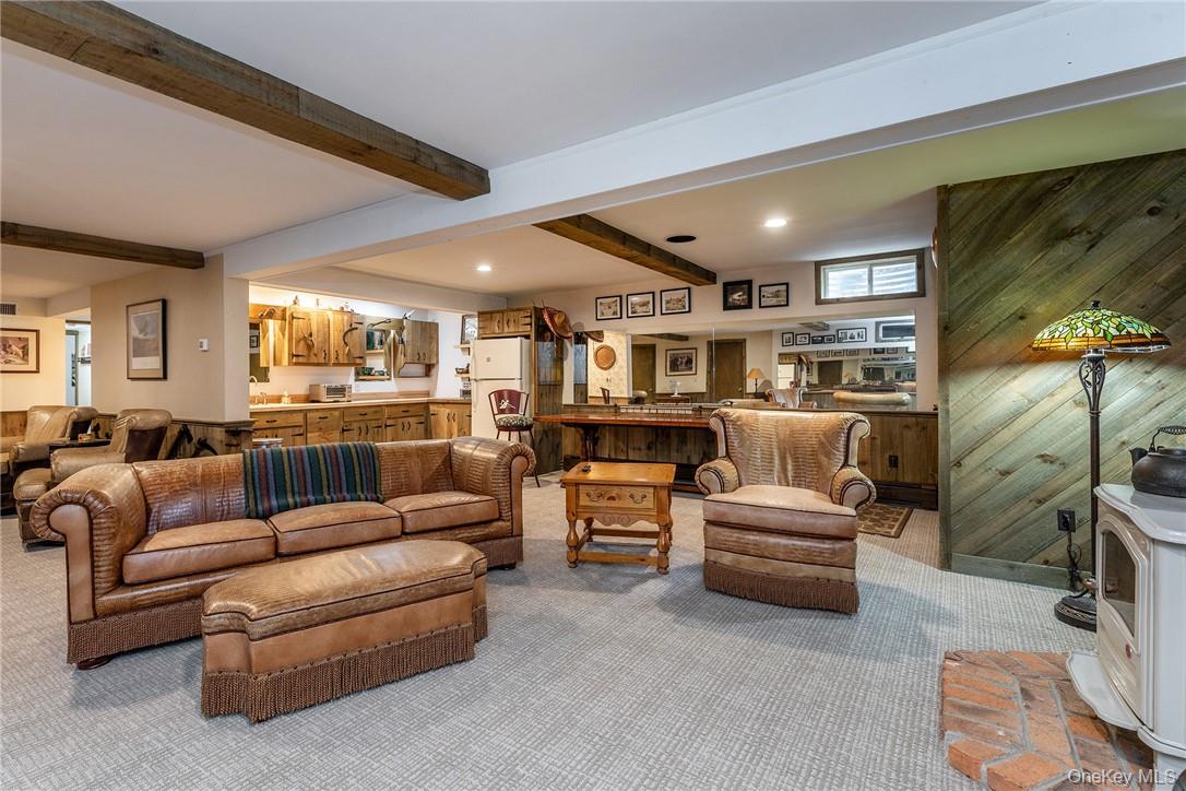 617 Bean River Road Pine Plains, NY 12546 - Photo 24 of 40 a living room with furniture and a flat screen tv