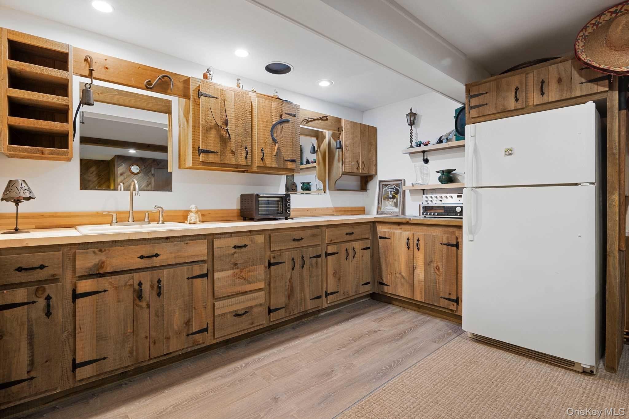 617 Bean River Road Pine Plains, NY 12546 - Photo 40 of 40 a kitchen with a sink a refrigerator and cabinets