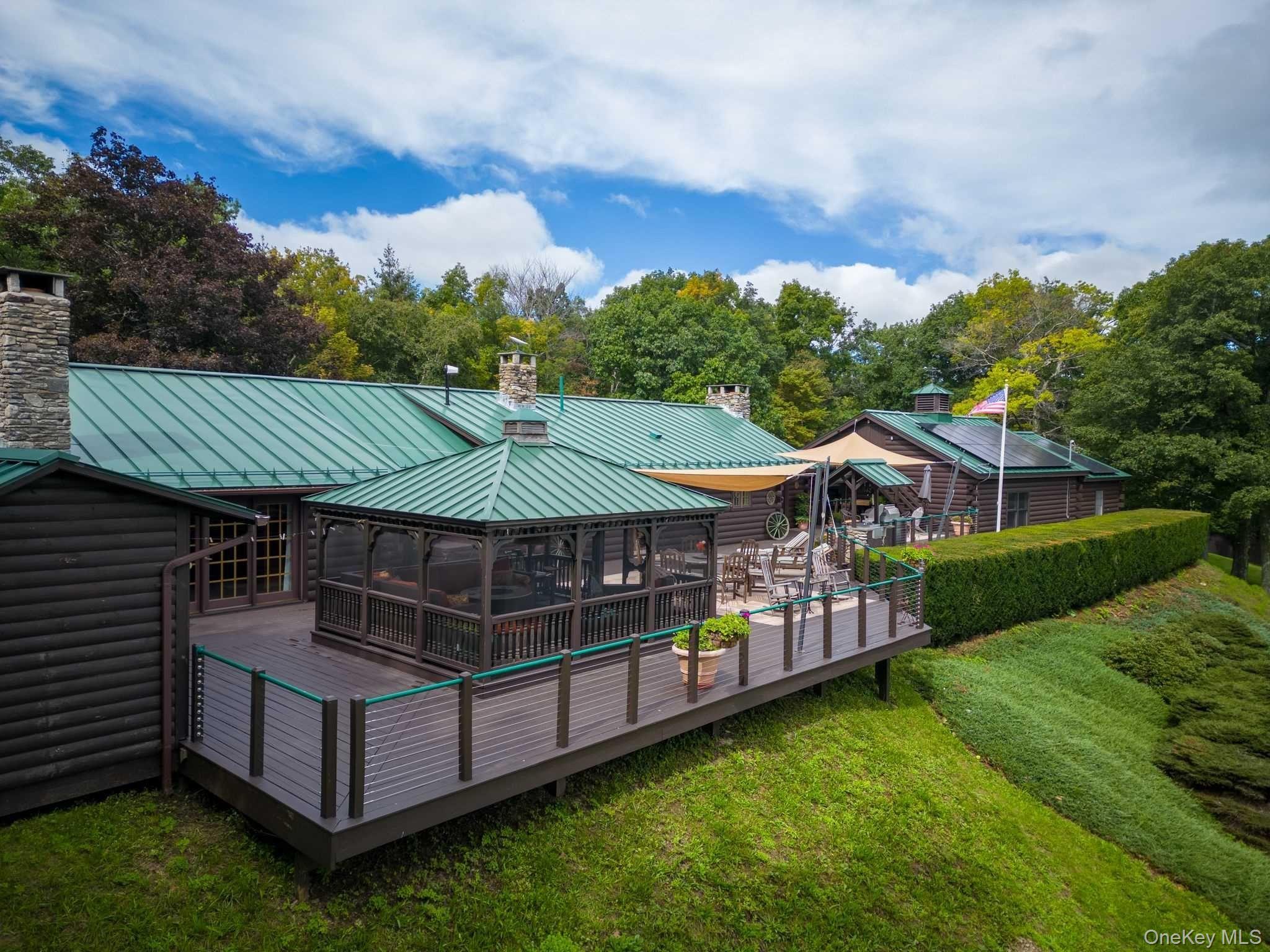 617 Bean River Road Pine Plains, NY 12546 - Photo 5 of 40 a view of a house with backyard and a hammock