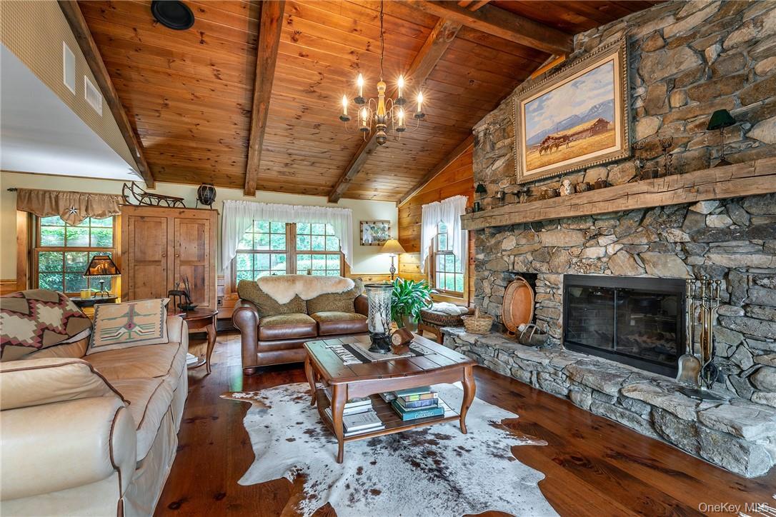 617 Bean River Road Pine Plains, NY 12546 - Photo 7 of 40 a living room with furniture a fireplace and a table