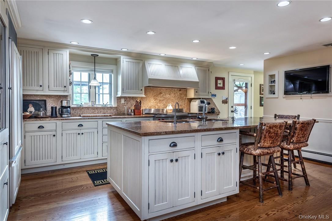 617 Bean River Road Pine Plains, NY 12546 - Photo 8 of 40 a kitchen with granite countertop white cabinets and chairs