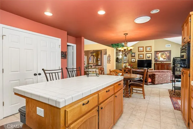 a dining room with furniture and chandelier