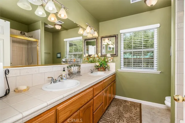 a kitchen with a refrigerator and a sink