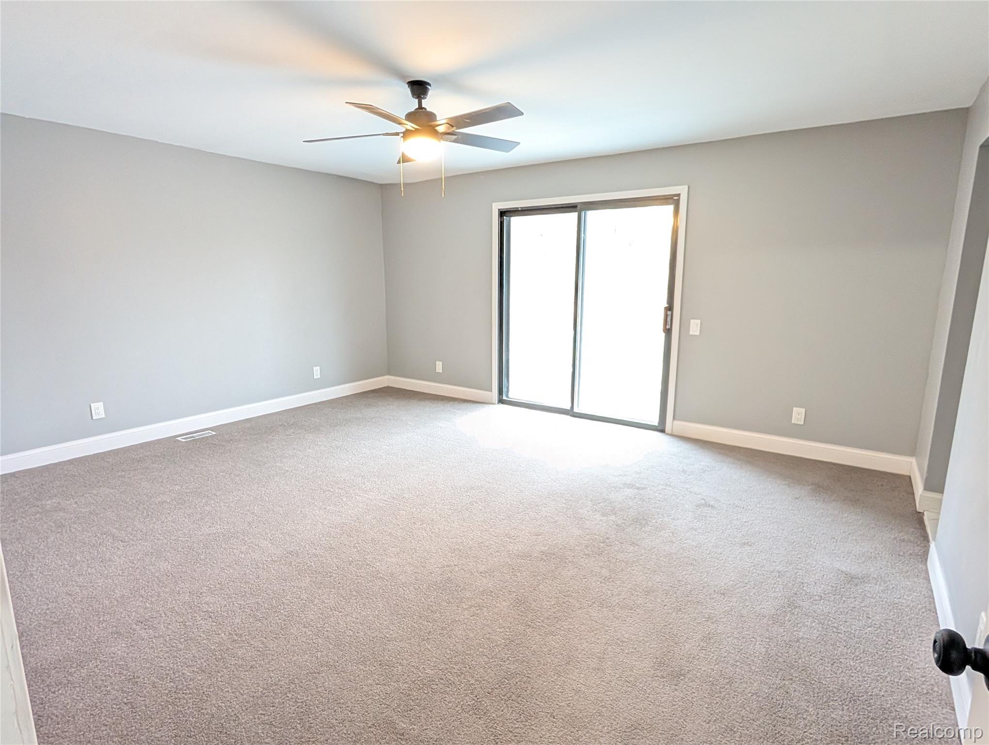 6353 Perry Road Grand Blanc, MI 48439 - Photo 19 of 34 Large primary bedroom with doorwall.