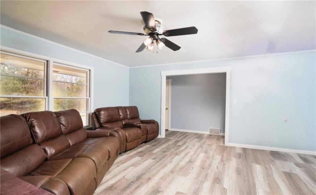 98 Almon Church Road Covington, GA 30014 - Photo 15 of 22 a living room with furniture and a window