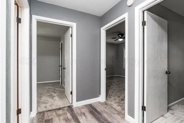 a view of a bathroom from a corridor