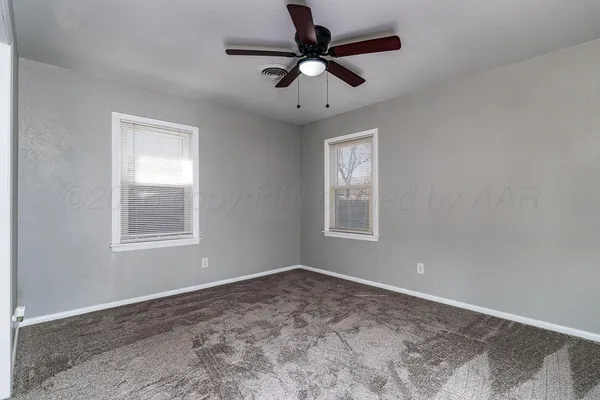 a view of an empty room with a window