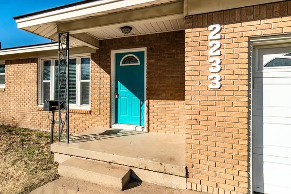 a front view of a house with street