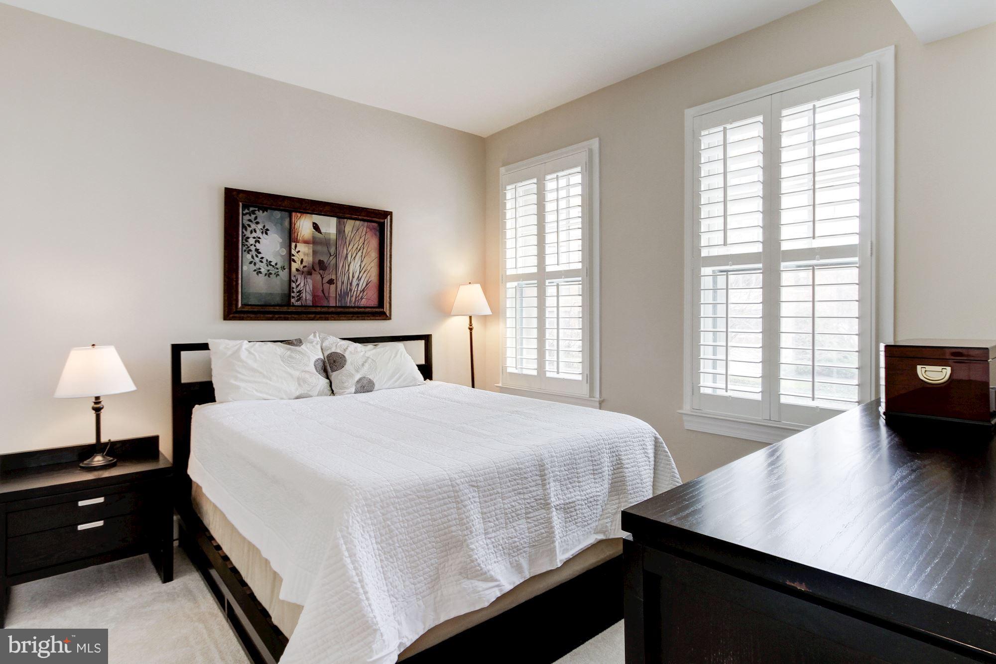 2902 Porter Street Northwest, Unit 21 Washington, DC 20008 - Photo 14 of 18 a bedroom with a bed and a window