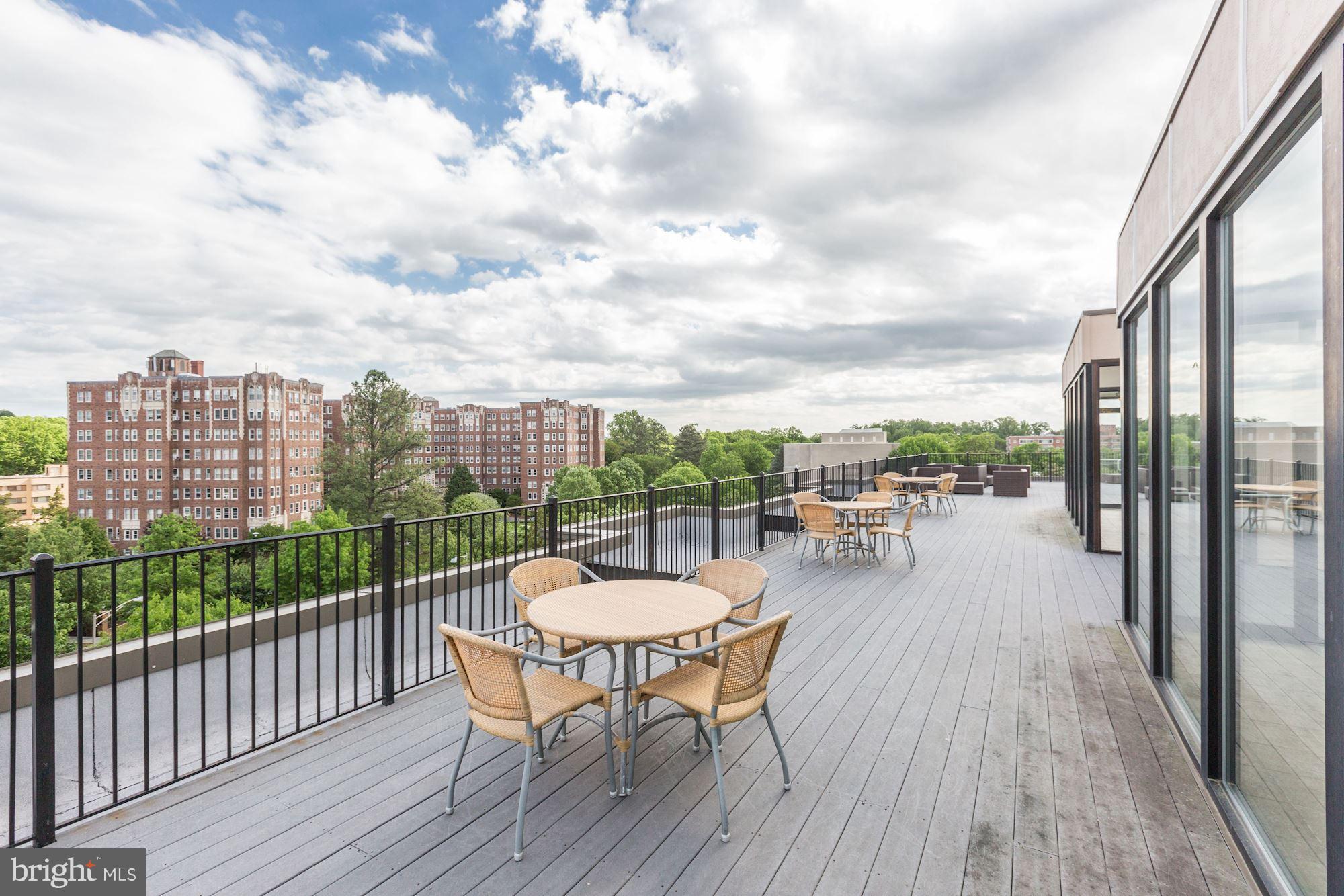 2902 Porter Street Northwest, Unit 21 Washington, DC 20008 - Photo 17 of 18 a view of a balcony with chairs and wooden floor