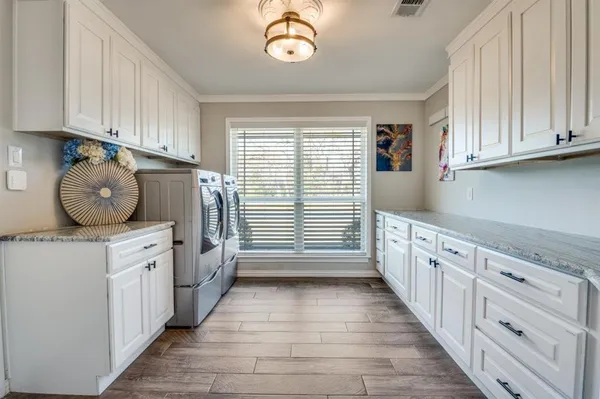 a kitchen with granite countertop a stove and a window