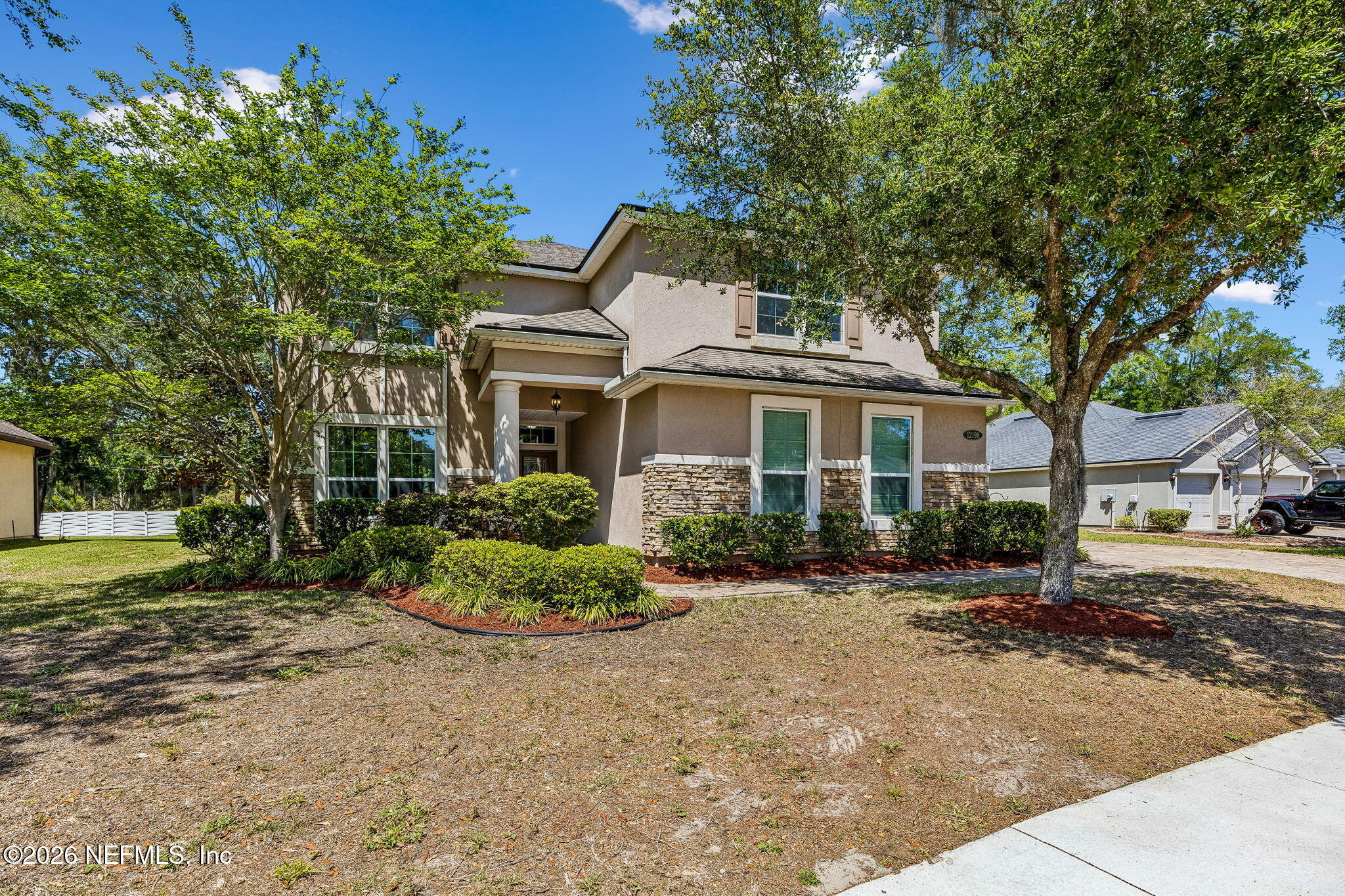 12198 Ridge Crossing Way Jacksonville, FL 32226 - Photo 4 of 67 a front view of a house with a yard
