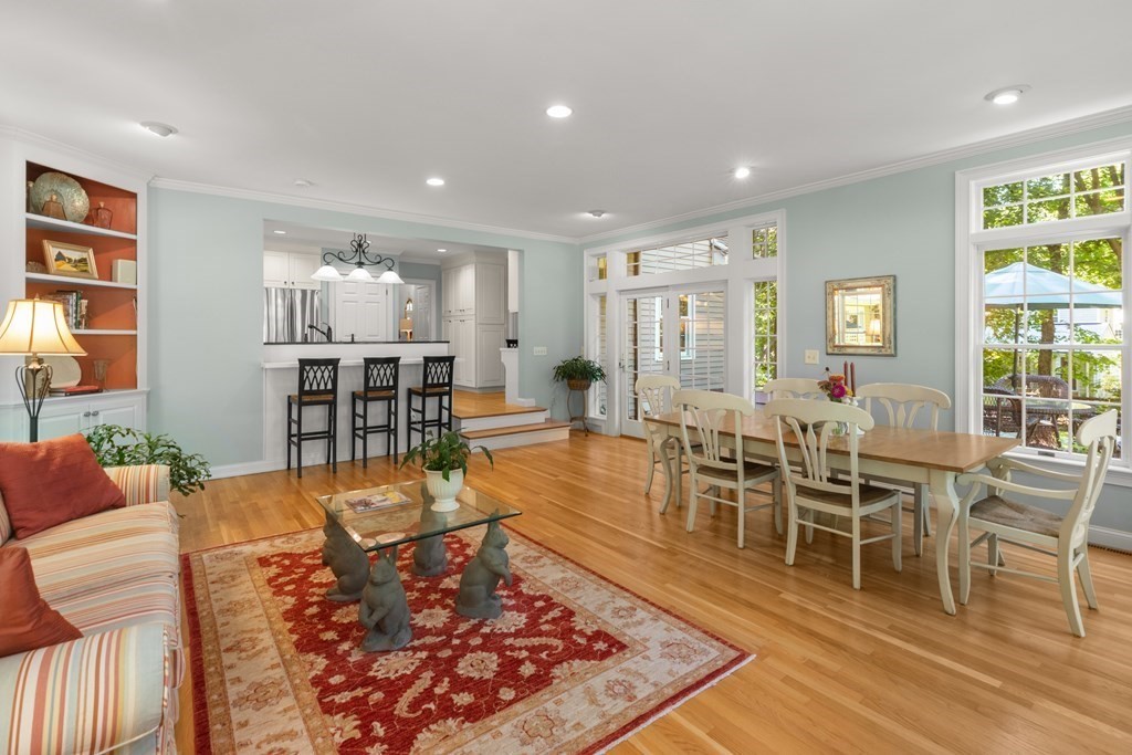 220 Perkins Row Topsfield, MA 01983 - Photo 11 of 42 a living room with furniture wooden floor and a table