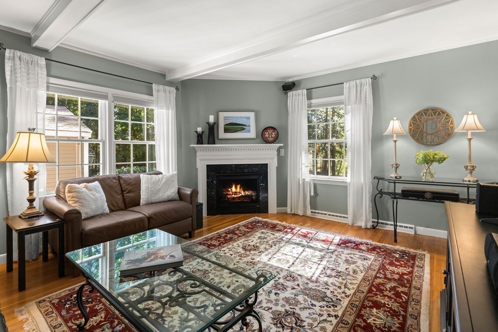 220 Perkins Row Topsfield, MA 01983 - Photo 12 of 42 a living room with furniture and a fireplace