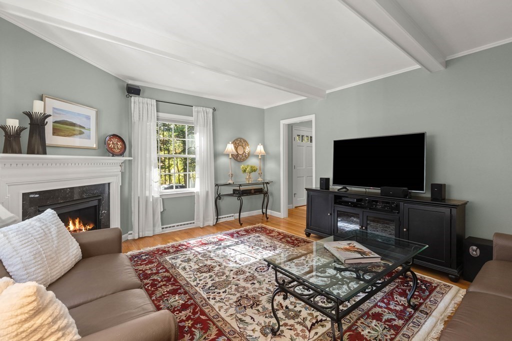 220 Perkins Row Topsfield, MA 01983 - Photo 13 of 42 a living room with furniture and a flat screen tv