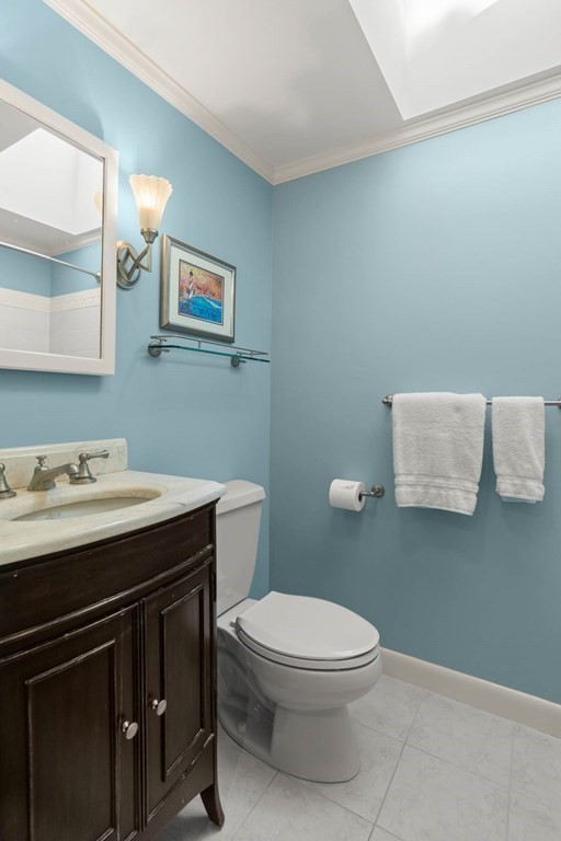 220 Perkins Row Topsfield, MA 01983 - Photo 18 of 42 a bathroom with a sink a toilet and mirror