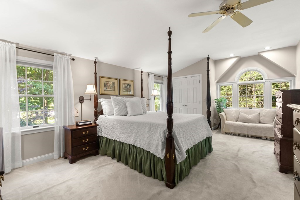 220 Perkins Row Topsfield, MA 01983 - Photo 21 of 42 a spacious bedroom with a bed window and couch